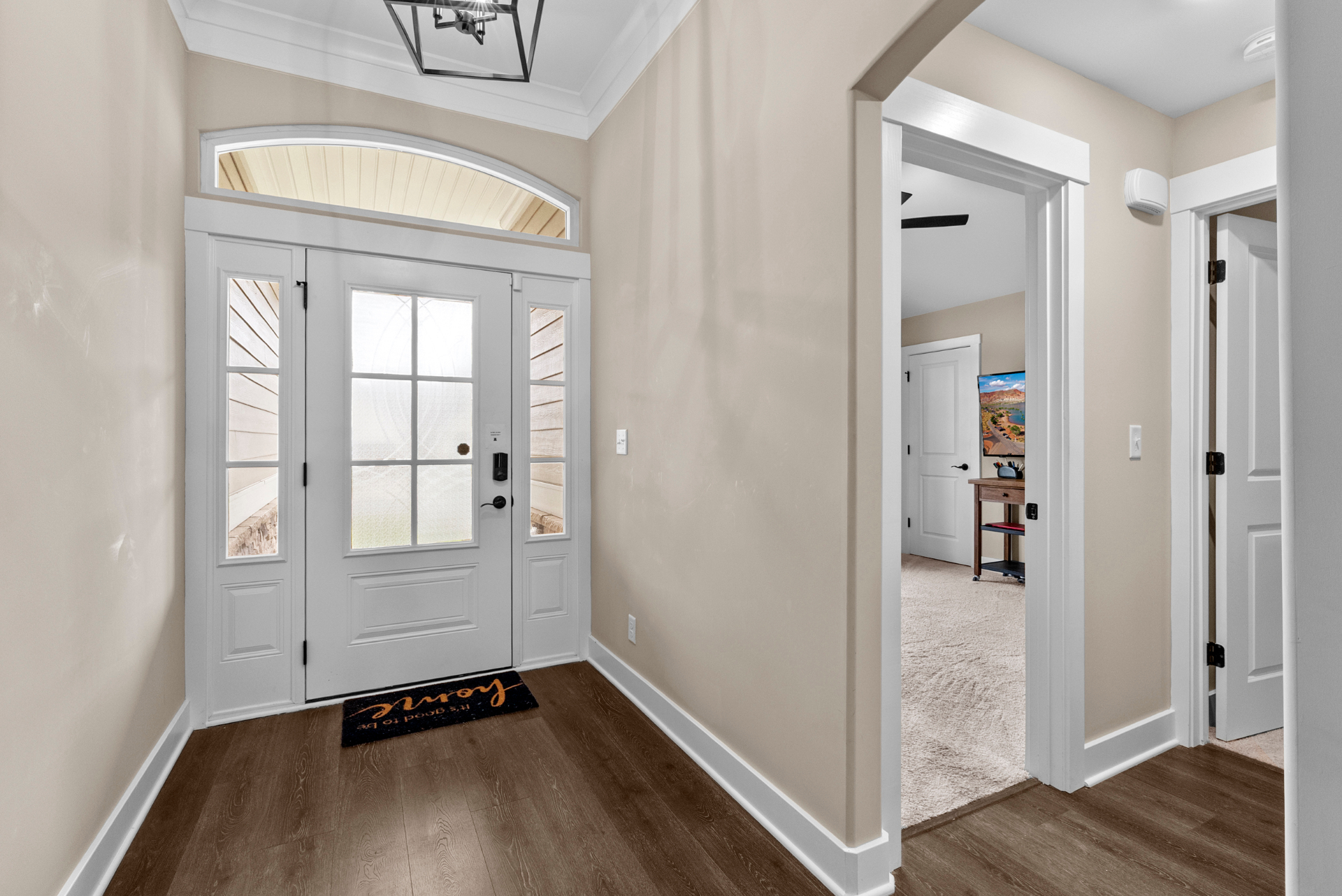Foyer with arched pass-through to the kitchen
